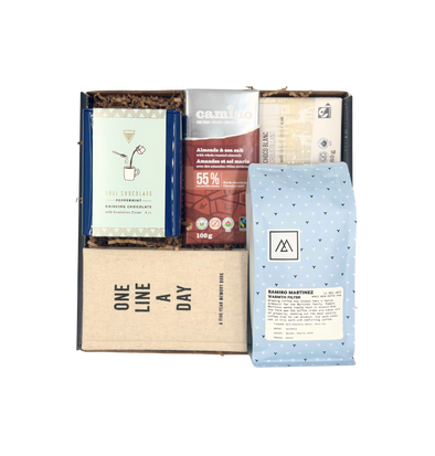 This gift box includes gourmet coffee beans, one line a day journal, peppermint drinking chocolate and two organic chocolate bars.