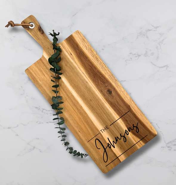 This is a picture of a personalized cutting board with the client's last name engraved on the board