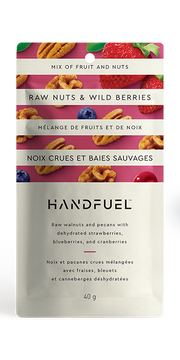 Handfuel raw nuts and wild berries package on a white background