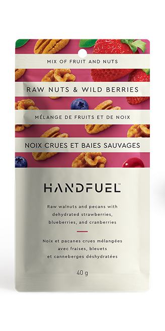 Handfuel raw nuts and wild berries package on a white background