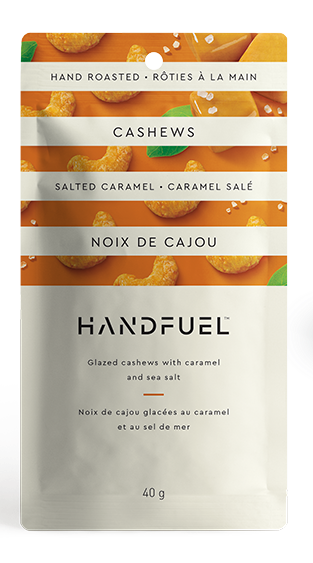 Handfuel cashew snack packages on a white background