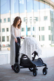 XO Muslin swaddle blanket on stroller